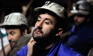 Coal miner Primitivo Basalo with fellow strikers at the mine of Santa Cruz del Sil in northern Spain. [Photograph: Eloy Alonso/Reuters]